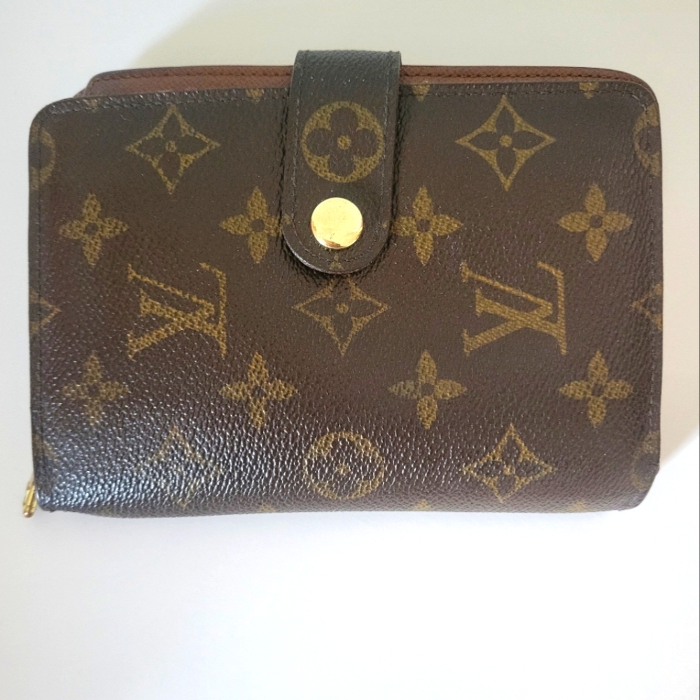 Louis Vuitton oversized monogram wallet. H-6 W-4.5